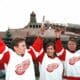 (L-R) Russian Detroit Red Wings Stanley Cup '97 winners Igor Larionov, Slava Kozlov and Slava Fetisov hold aloft the Cup 17 August at the Red Square in front of Lenin's Mausoleum. The Cup arrived in Moscow yesterday and will be displayed for several days here during International "Spartak" Icehockey Tornament which opens tonight. Each winning Stanley Cup player is entitled to take the trophy back home for a couple of days.