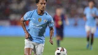 Orlando, FL:  Manchester City midfielder Oscar Bobb (52) dribbles the ball down the pitch during the DIRECTV Soccer Champions Tour game against FC Bar