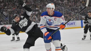 Apr 23, 2025; Los Angeles, California, USA;  Los Angeles Kings defenseman Drew Doughty (8) and Edmonton Oilers center Connor McDavid (97) battle on the ice in the first period of game 2 of the 2025 Stanley Cup Playoffs at Crypto.com Arena. Mandatory Credit: Jayne Kamin-Oncea-Imagn Images