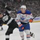 Apr 23, 2025; Los Angeles, California, USA;  Los Angeles Kings defenseman Drew Doughty (8) and Edmonton Oilers center Connor McDavid (97) battle on the ice in the first period of game 2 of the 2025 Stanley Cup Playoffs at Crypto.com Arena. Mandatory Credit: Jayne Kamin-Oncea-Imagn Images