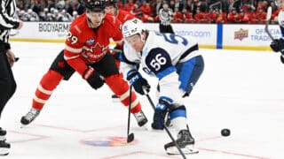 XXKEIKKAXX  February 17, 2025, Boston, MA, USA: Team Finland forward Erik Haula (56) faces off against Team Canada forward Nathan MacKinnon (29) during the second period of the 4 Nations Face Off game  at TD Garden. Eric Canha All Over Press