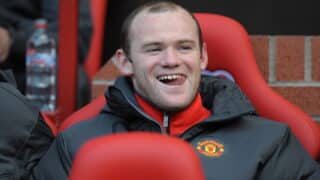 epa02395428 Manchester United's Wayne Rooney on the bench during the English Premier League match between Manchester United and West Bromwich Albion at the Old Trafford Stadium, Manchester, Britain, 16 October 2010.  EPA/FOTOSPORTS/ROBIN PARKER NO ONLINE OR INTERNET USE WITHOUT A LICENSE FROM THE FOOTBALL DATA CO. LTD.