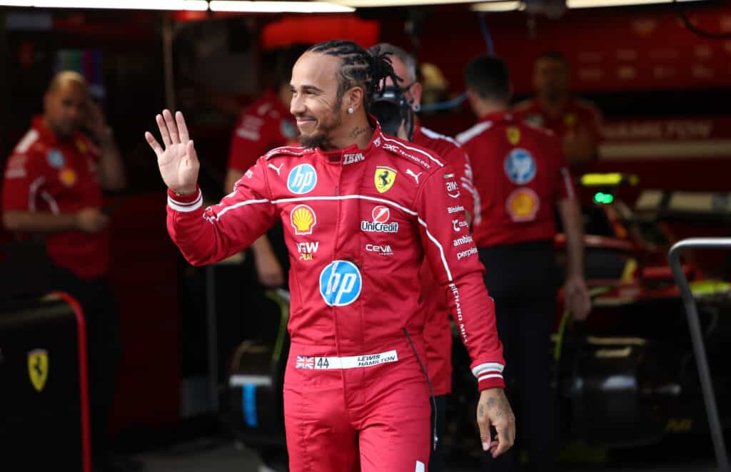epa12387326 Scuderia Ferrari driver Lewis Hamilton of Britain waves in the garage at the Baku City Circuit in Baku, Azerbaijan, 18 September 2025. The 2025 Formula 1 Azerbaijan Grand Prix will take place on 21 September.  EPA/ALI HAIDER