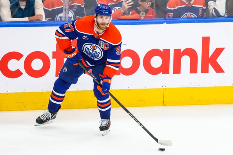 Jun 14, 2025; Edmonton, Alberta, CAN; Edmonton Oilers center Connor McDavid (97) controls the puck against the Florida Panthers during the second period in game five of the 2025 Stanley Cup Final at Rogers Place. Mandatory Credit: Sergei Belski-Imagn Images