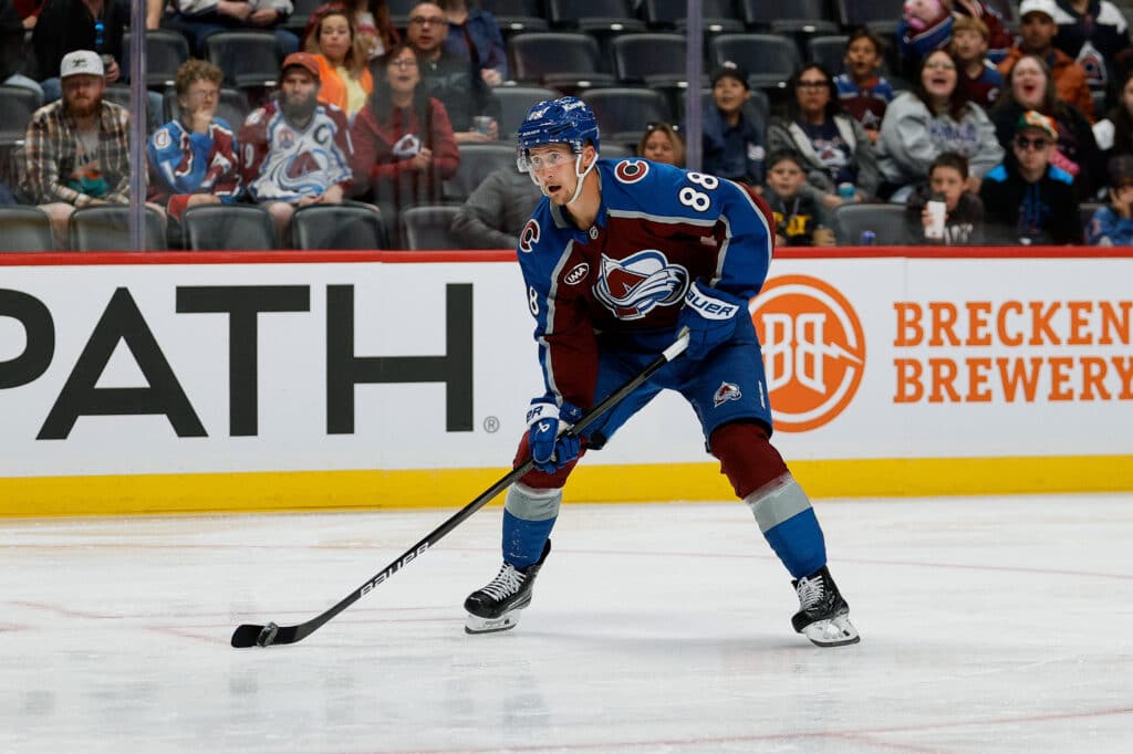 Sep 21, 2025; Denver, Colorado, USA; Colorado Avalanche center Martin Necas (88) controls the puck in the second period against the Utah Mammoth at Ball Arena. Mandatory Credit: Isaiah J. Downing-Imagn Images