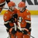 Apr 9, 2025; Anaheim, California, USA;  Anaheim Ducks left wing Cutter Gauthier (61) is congratulated by center Leo Carlsson (91) after a goal during the third period against the Calgary Flames as Honda Center. Mandatory Credit: Jayne Kamin-Oncea-Imagn Images