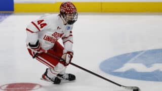 Mar 29, 2025; Toledo, OH, USA; Boston University defenseman Cole Hutson (44) skates with the puck in the first period against the Cornell at Huntington Center. Mandatory Credit: Rick Osentoski-Imagn Images