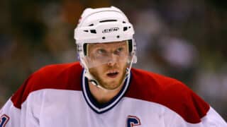 Jan 27, 2007; Toronto, ON, Canada; Montreal Canadiens center (11) Saku Koivu looks on against the Toronto Maple Leafs center (21) John Pohl at the Air Canada Centre in Toronto, ON. Mandatory Credit: Tom Szczerbowski-USA TODAY Sports