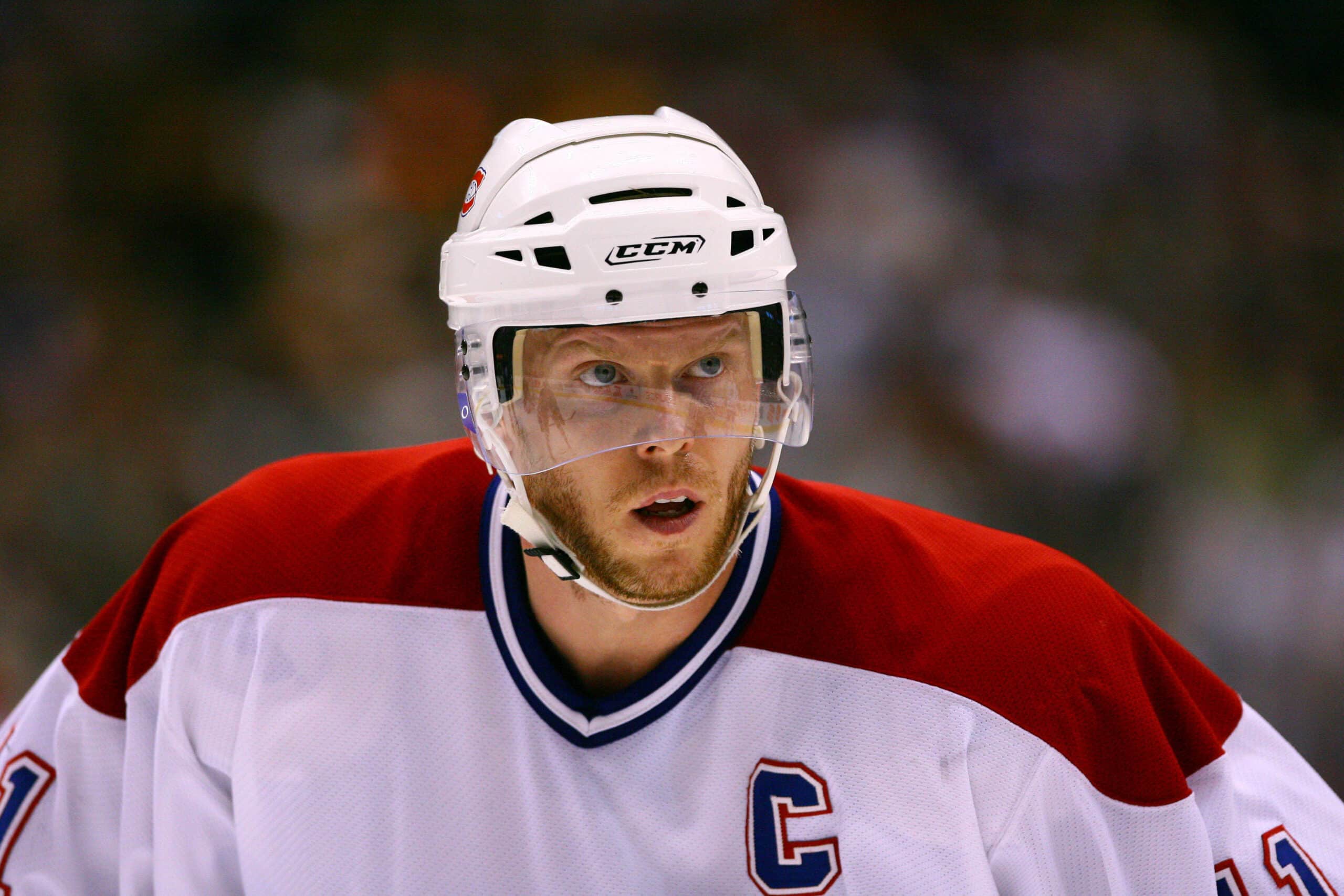 Jan 27, 2007; Toronto, ON, Canada; Montreal Canadiens center (11) Saku Koivu looks on against the Toronto Maple Leafs center (21) John Pohl at the Air Canada Centre in Toronto, ON. Mandatory Credit: Tom Szczerbowski-USA TODAY Sports